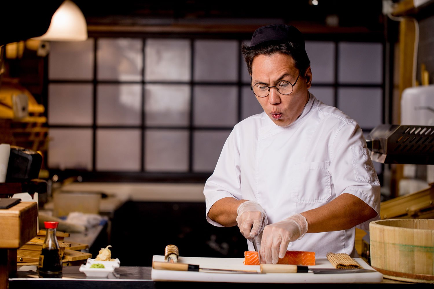 Chef working at a traditional Japanese counter